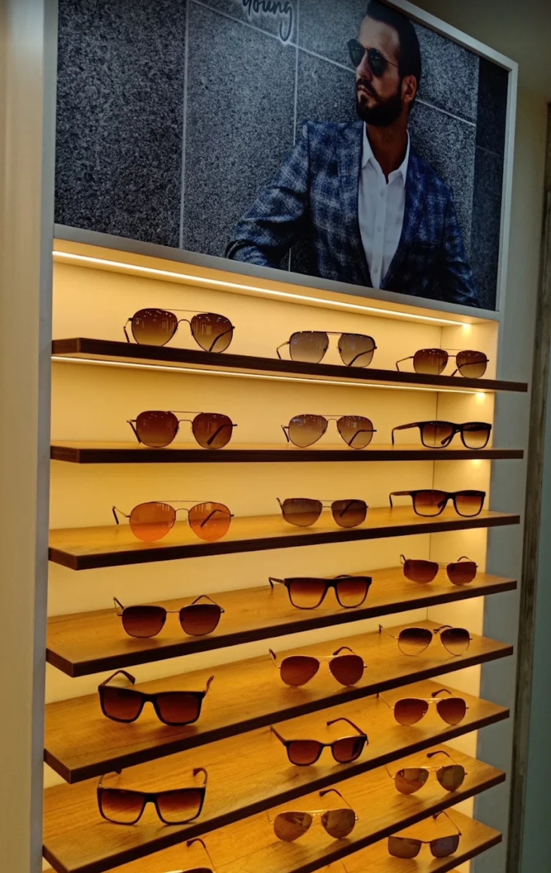 Illuminated sunglasses display wall at Shree Optics Kharadi