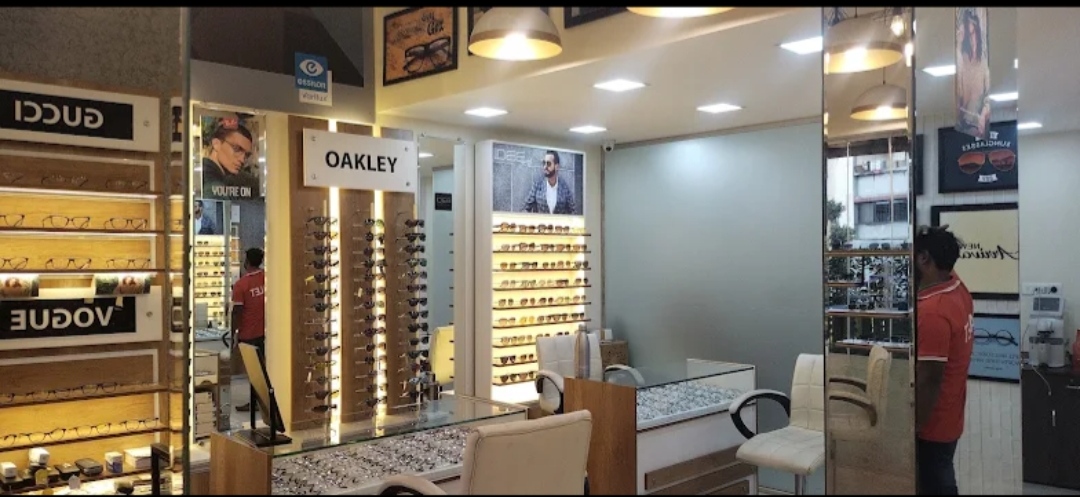 Shree Optics store interior with Oakley, Gucci and Vogue eyewear displays