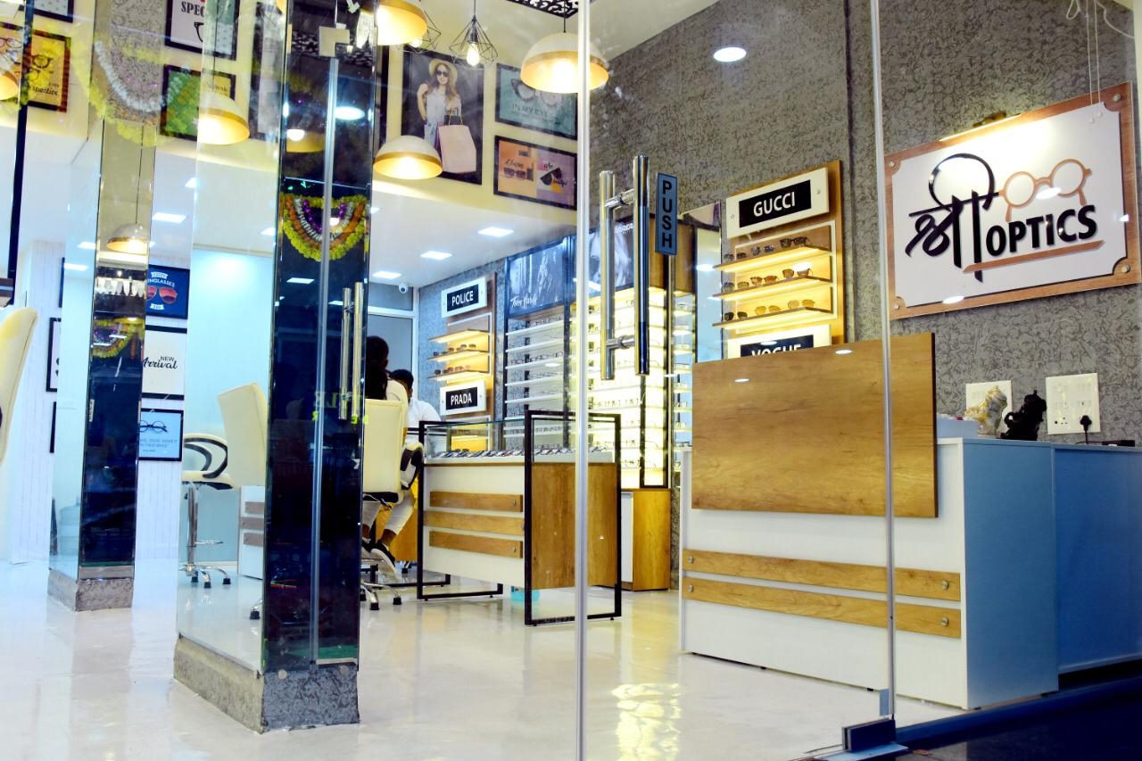 Shree Optics showroom entrance with Gucci, Police and Prada eyewear sections