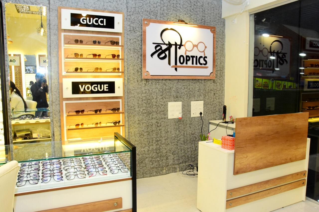 Shree Optics store signage with Gucci and Vogue eyewear displays in Kharadi, Pune
