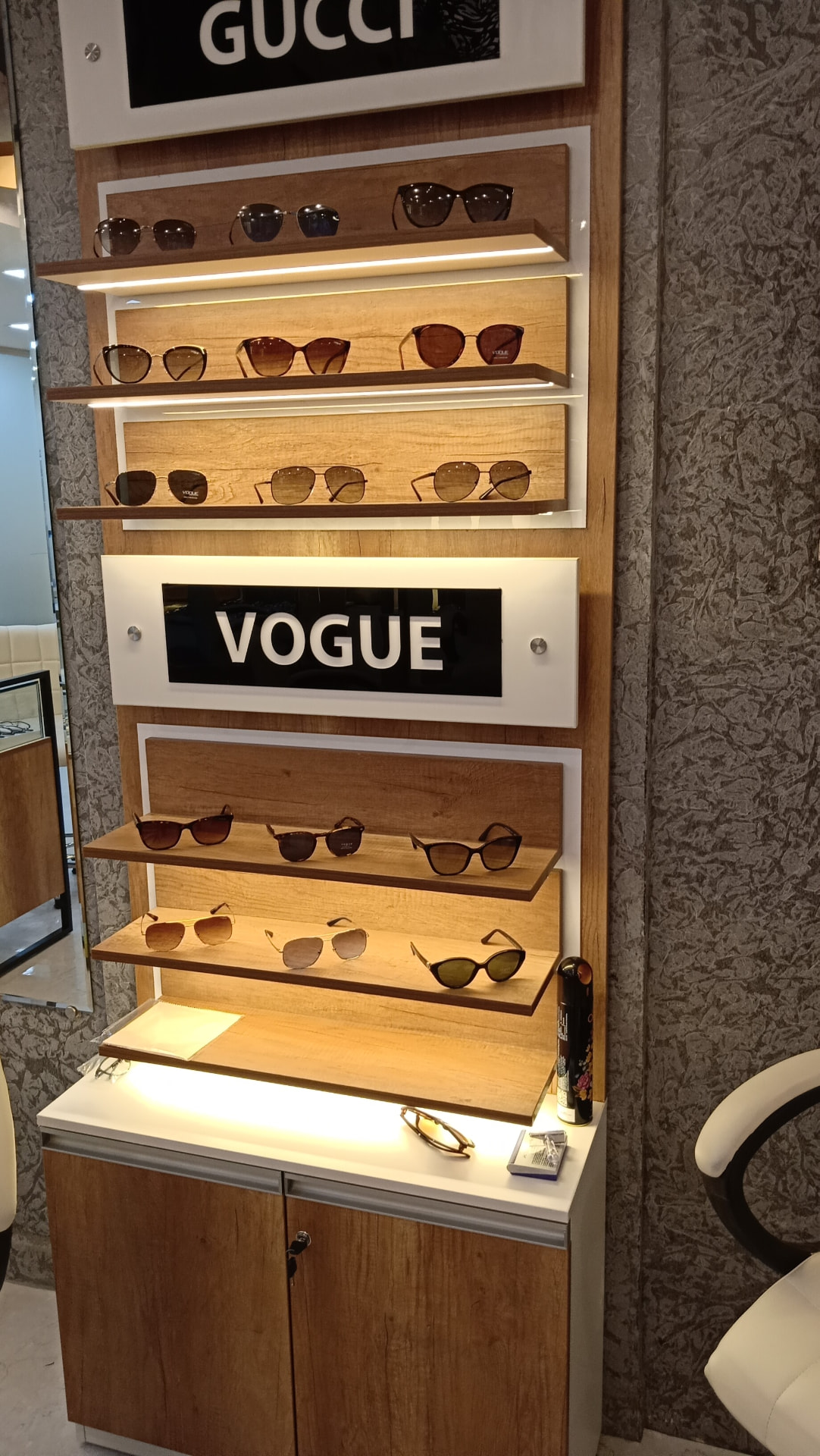 Vogue and Gucci sunglasses shelves at Shree Optics