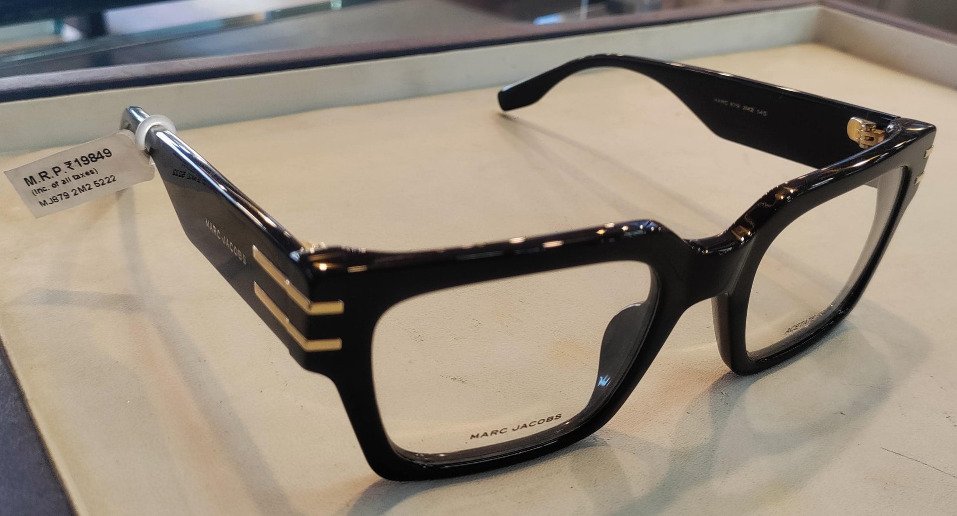 Black acetate rectangular eyeglass frame with gold detailing