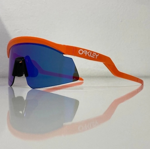 Side profile of orange Oakley Hydra sunglasses